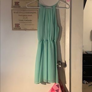 A short silk teal dress.